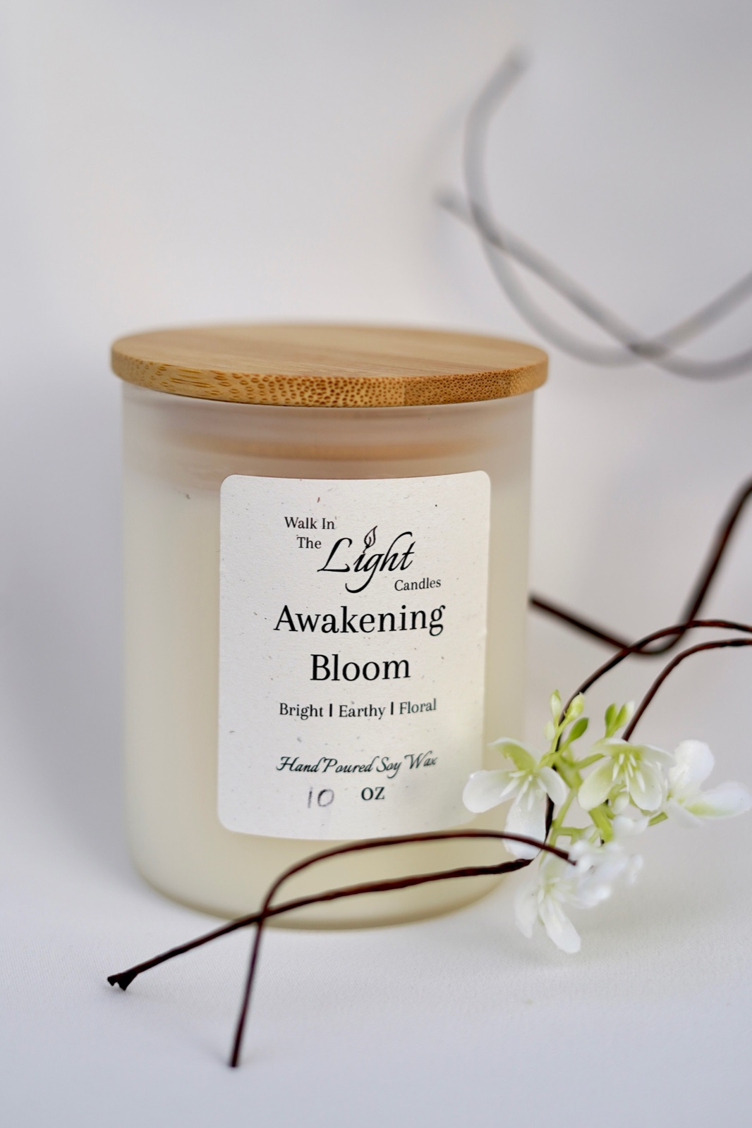 Awakening Bloom candle with white blossoming branch